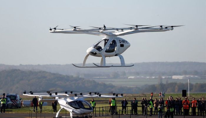 A Volocopter 2X drone taxi performs an integrated flight in conventional air traffic at Pontoise airfield in Cormeilles-en-Vexin, near Paris, France, November 10, 2022. R