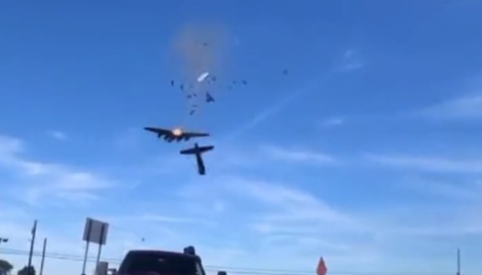 Two vintage military planes collide in midair at a World War Two commemorative airshow in Dallas, US, on November 13, 2022. — Twitter/JamesYoder