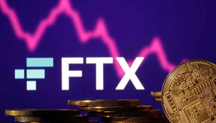 Representations of cryptocurrencies are seen in front of displayed FTX logo and decreasing stock graph in this illustration taken November 10, 2022.— Reuters