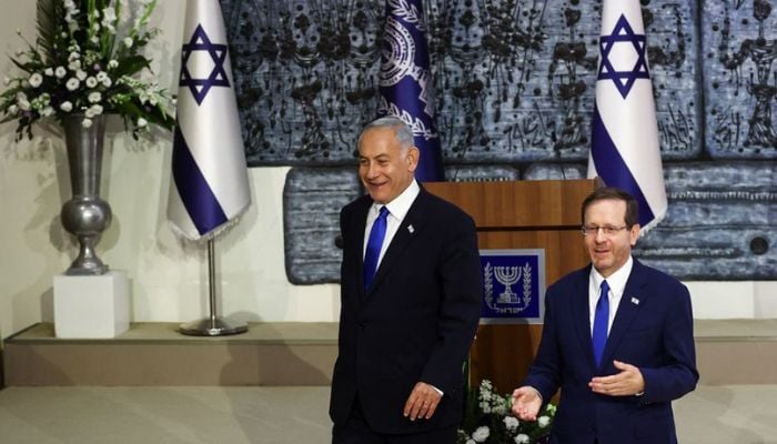 Likud party leader Benjamin Netanyahu greets his supporters at his party headquarters during Israels general election in Jerusalem, November 2, 2022.— Reuters