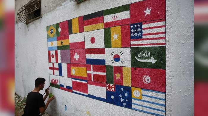 Football enthusiasts brighten up streets of Malir for FIFA World Cup