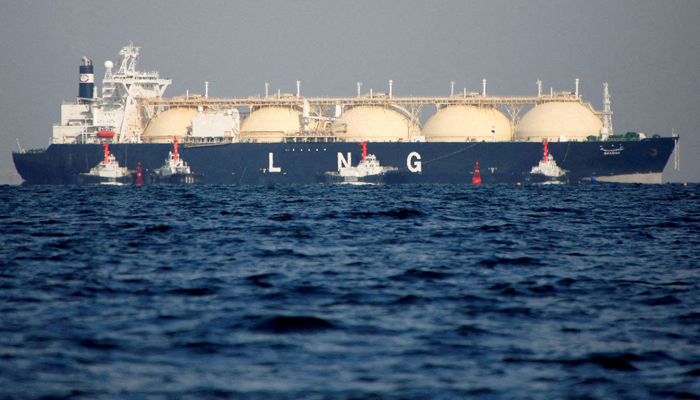 A liquefied natural gas (LNG) tanker is tugged towards a thermal power station in Futtsu, east of Tokyo, Japan November 13, 2017. — Reuters