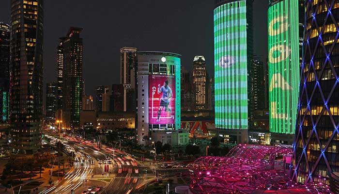 An image of Uruguays Luis Suarez is seen at dusk on a building in Doha on November 13, 2022, ahead of the Qatar 2022 World Cup football tournament. — AFP