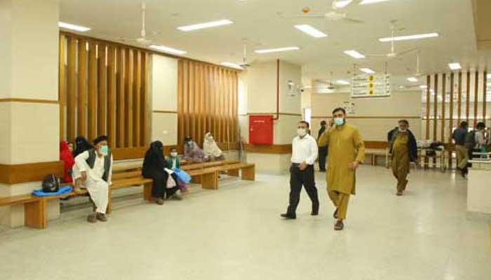 Patients walk into the OPD of the Jinnah Postgraduate Medical Centre. — JPMC/File