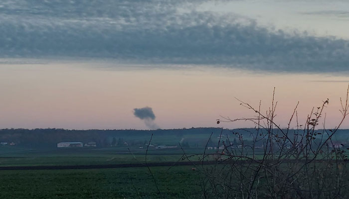 Smoke rises in the distance, amid reports of two explosions, seen from Nowosiolki, Poland, near the border with Ukraine November 15, 2022 in this image obtained from social media. Reuters