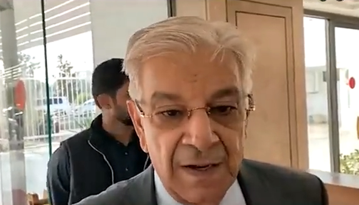 Minister for Defence Khawaja Asif speaks to journalistsoutside the parliament in Islamabad on November 16, 2022. — Twitter