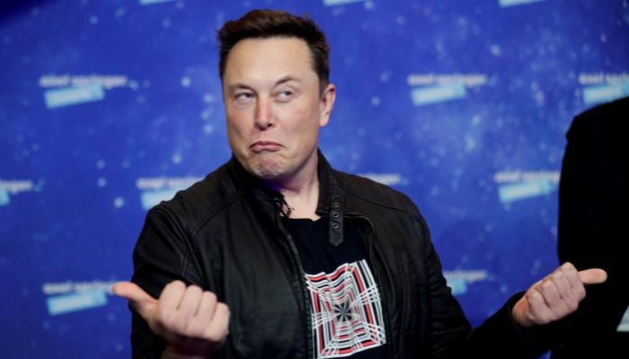 SpaceX owner and Tesla CEO Elon Musk grimaces after arriving on the red carpet for the Axel Springer award, in Berlin, Germany, December 1, 2020.— Reuters