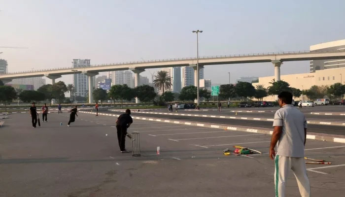 A street cricket match in a carpark in Dubai — AFP