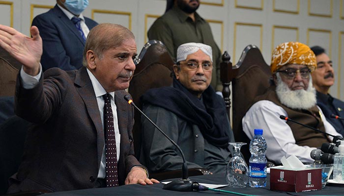 (L to R) Prime Minister Shehbaz Sharif speaks during a press conference next to PPP Co-chairman Asif Ali Zardari, and PDM chief Fazlur Rehman in Islamabad on March 8, 2022. — AFP