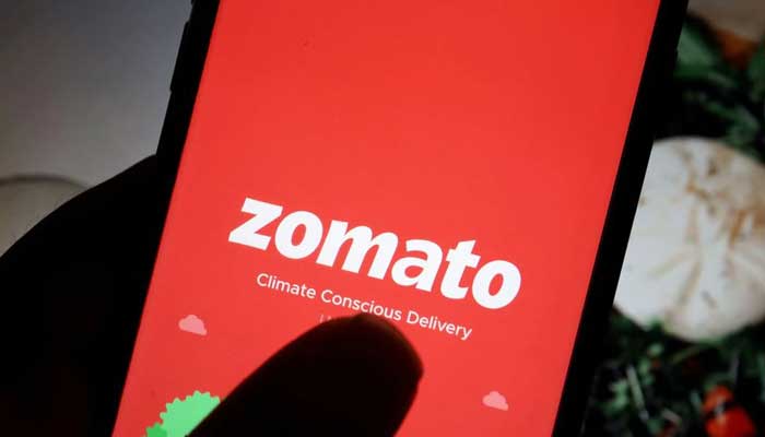 The logo of Indian food delivery company Zomato is seen on its app on a mobile phone displayed in front of its company website in this illustration picture taken July 14, 2021. — Reuters