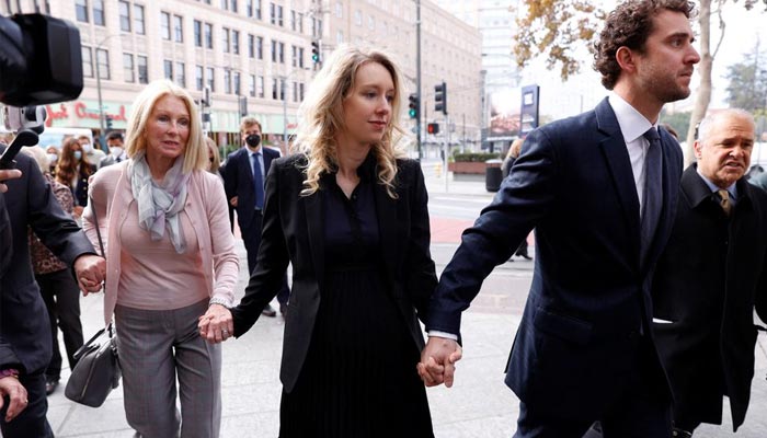 Theranos founder Elizabeth Holmes arrives with her family and partner Billy Evans to be sentenced on her convictions for defrauding investors in the blood testing startup at the federal courthouse in San Jose, California, U.S., November 18, 2022. — Reuters