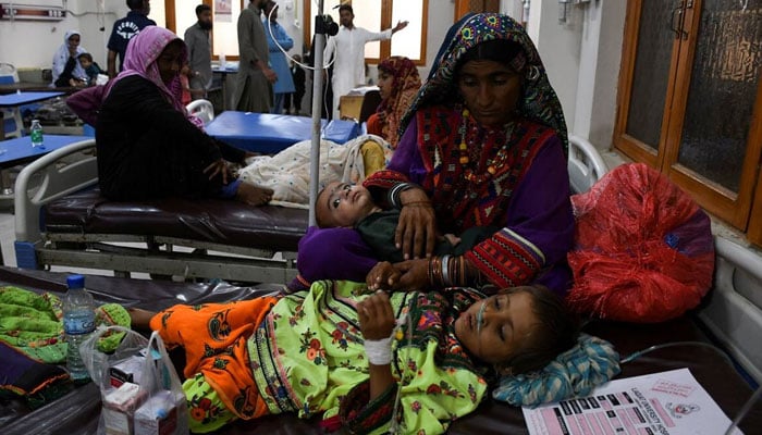A woman, who became flood victim, takes care of her ailing baby at a hospital, following rains and floods during the monsoon season in Jamshoro, Pakistan September 20, 2022. — Reuters