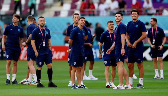 England players on the pitch before the match. — AFP