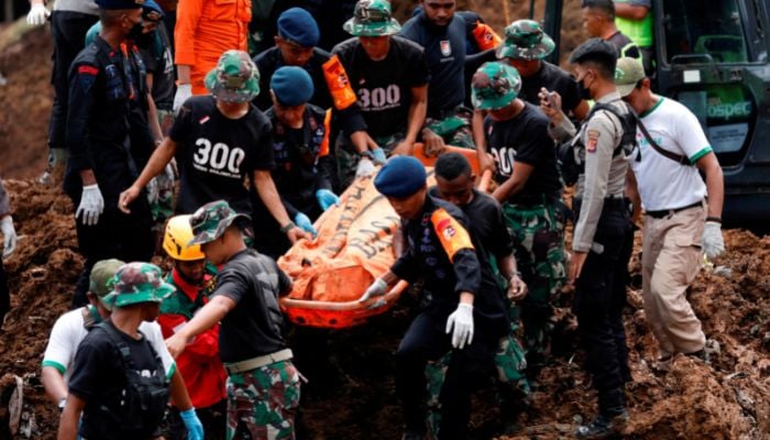 Indonesia rescue members carry a victims body from the site of a landslide caused by the earthquake in Cugenang, Cianjur, West Java province, Indonesia, November 22, 2022.— Reuters