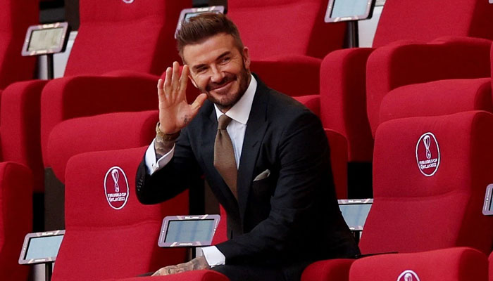 David Beckham waves at fans as he attends England’s first World Cup game in Qatar