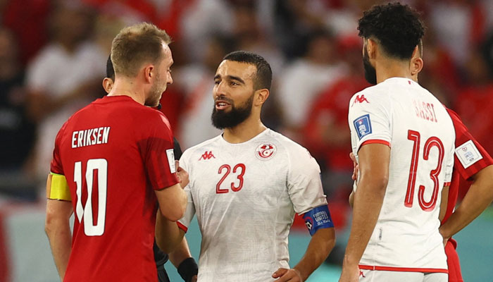 Tunisias Naim Sliti shakes hands with Denmarks Christian Eriksen after the match. — Reuters