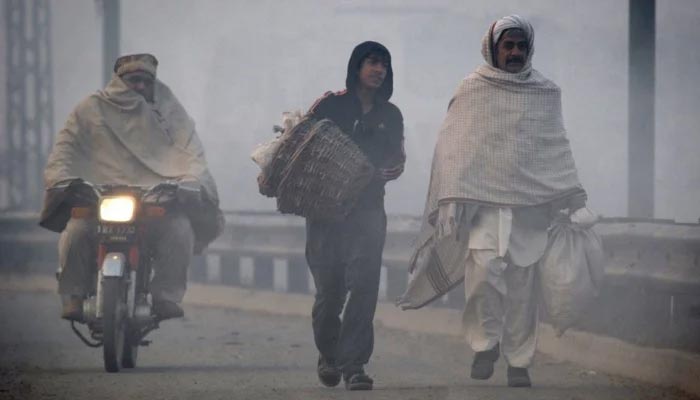 A representational image of men walking on road. — Reuters/File
