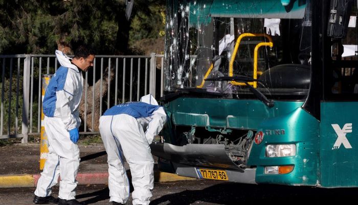 Israeli police inspect a damaged bus following an explosion at a bus stop in Jerusalem November 23, 2022.— Reuters