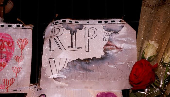 Flowers and notes are displayed in front of a school following the rape and murder of a 14-year-old girl in Tonneins, France, on November 21, 2022.— Reuters