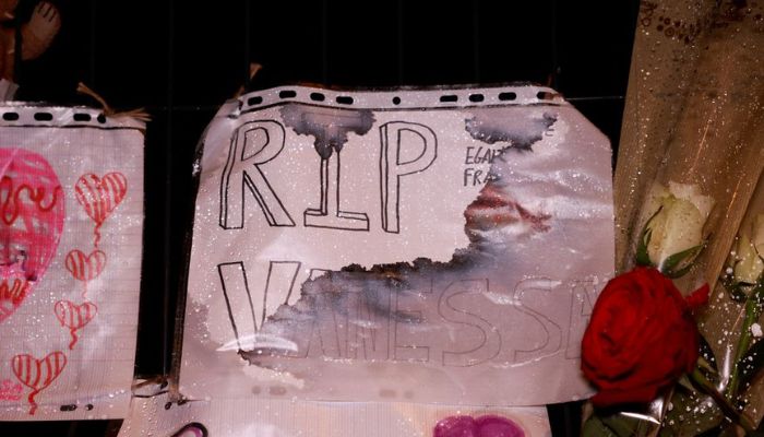 Flowers and notes are displayed in front of a school following the rape and murder of a 14-year-old girl in Tonneins, France, on November 21, 2022.— Reuters