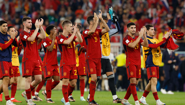 Spain players applaud fans after the match. —Reuters