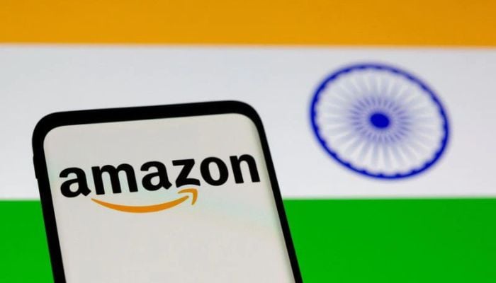 Smartphone with Amazon logo is seen in front of displayed Indian flag in this illustration taken, July 30, 2021.— Reuters