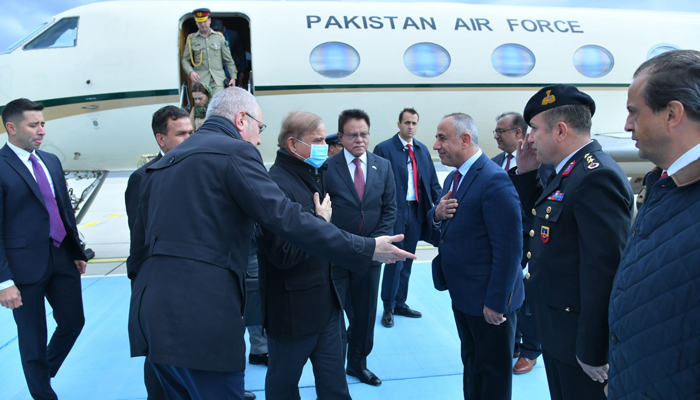 Prime Minister Shehbaz Sharif (2C) gestures as Turkish officials greet him after he landed at the Istanbul International Airport in Turkiye, on November 25, 2022. — Twitter/PML-N