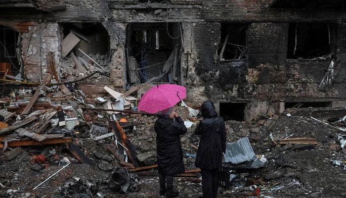 Local residents stand near their building destroyed by a Russian missile attack, as Russias attack on Ukraine continues, in the town of Vyshhorod, near Kyiv, Ukraine November 24, 2022. — Reuters
