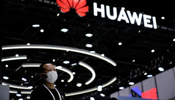 A person stands by a sign of Huawei during World Artificial Intelligence Conference, following the coronavirus disease (COVID-19) outbreak, in Shanghai, China, September 1, 2022.— Reuters