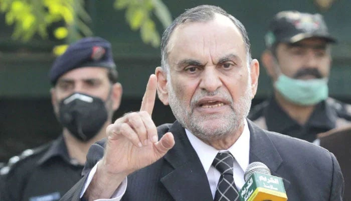 Azam Khan Swati addressing a press conference.— PID/File