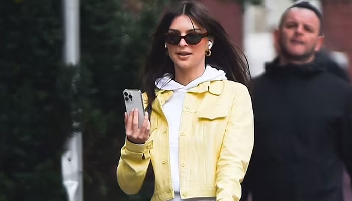 Emily Ratajkowski looks effortlessly chic as she takes her dog on morning walk