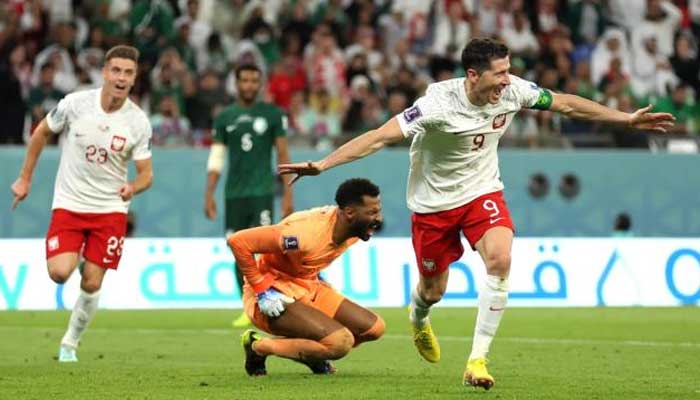 Robert Lewandowski (R) of Poland reacts after scoring his sides second goal during the second half of a World Cup Group C football match against Saudi Arabia at Education City Stadium in Al Rayyan, Qatar, on Nov. 26, 2022. — Reuters