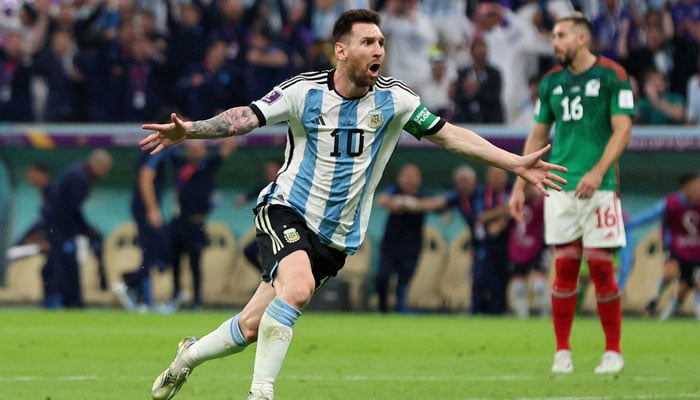 Argentinas Lionel Messi celebrates scoring their first goal against Mexico. — Reuters