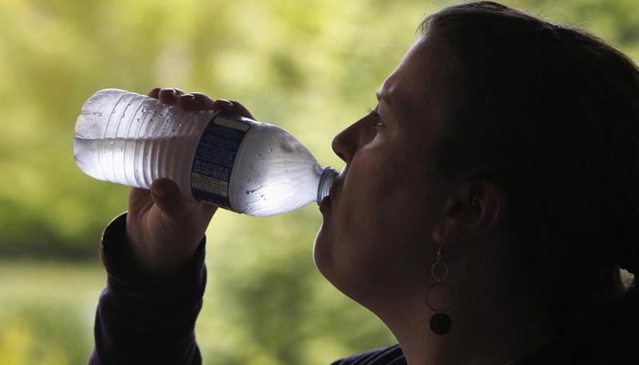 A woman drinks from a water bottle in Portland, Oregon May 23, 2014. — Reuters