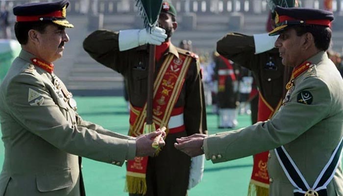 General Raheel Sharif receives a baton of command from General Parvez Kayani.— ISPR/FIle