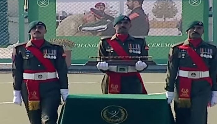 Pakistan Army soldiers bringing the Malacca cane stick  during the change of command ceremony at GHQ. — SCreegrab/PTV