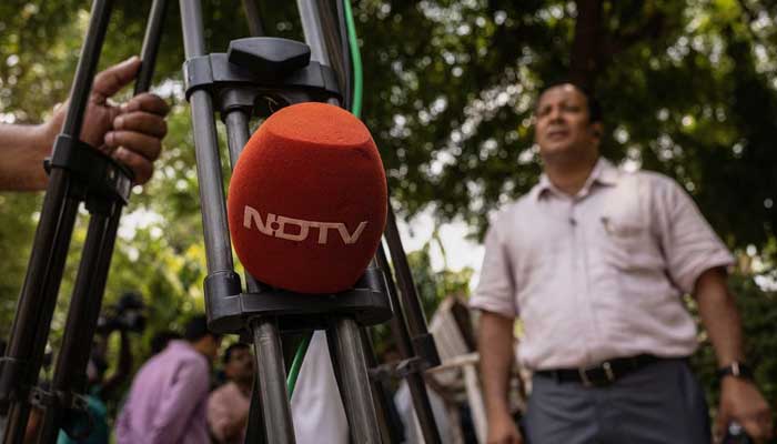 A microphone of New Delhi Television (NDTV) is placed on a tripod along a roadside in New Delhi, India, August 26, 2022. — Reuters/File