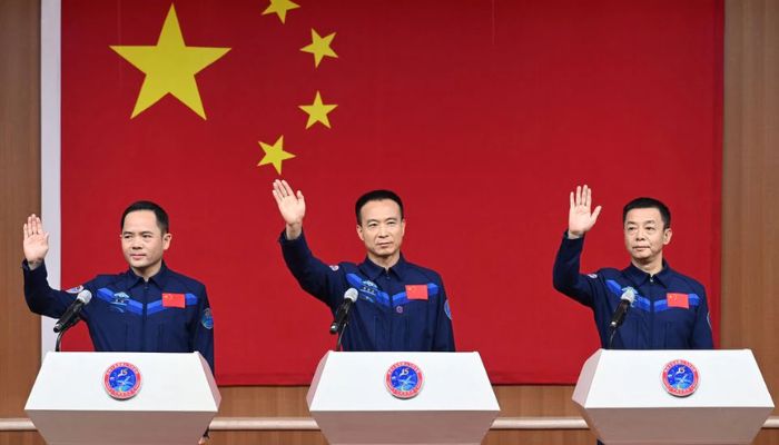 Astronauts Fei Junlong, Deng Qingming and Zhang Lu attend a news conference before the Shenzhou-15 spaceflight mission to build Chinas space station, at Jiuquan Satellite Launch Center, near Jiuquan, Gansu province, China November 28, 2022.— cnsphoto via Reuters