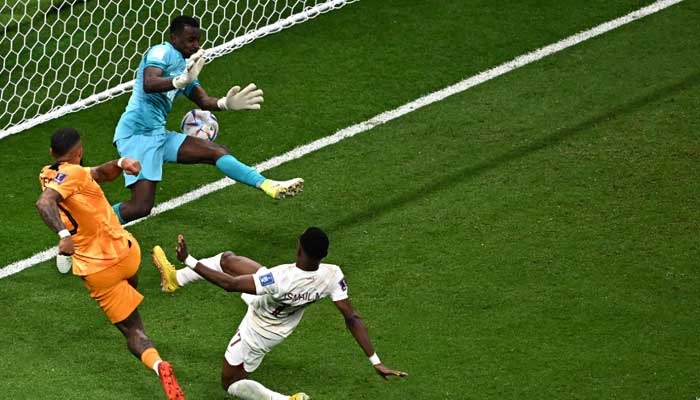 Qatar’s goalkeeper #22 Meshaal Barsham (Top) deflects a shot from Netherlands’ forward #10 Memphis Depay during the Qatar 2022 World Cup Group A football match between the Netherlands and Qatar at the Al-Bayt Stadium in Al Khor, north of Doha on November 29, 2022. — AFP