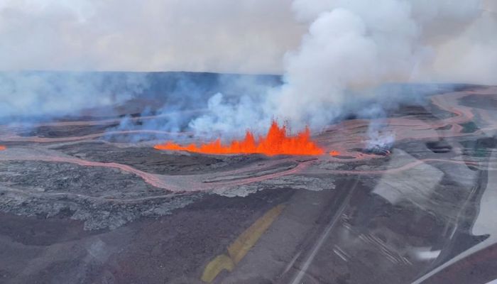 Helicopter cockpit aerial view of lava spewing out during Mauna Loa's eruption in Hawaii, U.S., November 28, 2022 in this still image taken from social media video.- Reuters
