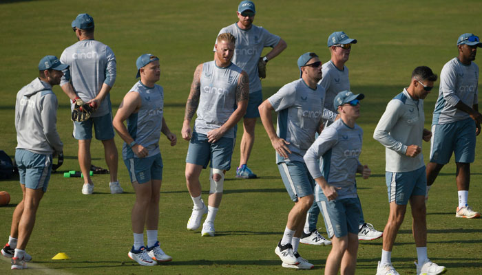 England captain Ben Stokes (C) warms up along with teammates during a training session ahead of their first cricket Test match against Pakistan, at the Rawalpindi Cricket Stadium in Rawalpindi on November 28, 2022. — AFP