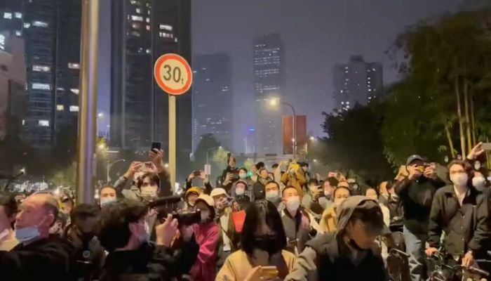 Protesters chant slogans in support of freedom of speech and the press, amid broader nationwide unrest due to COVID-19 lockdown policies, in Chengdu, China in this still image obtained from undated social media video released November 27, 2022.— Screengrab via Reuters