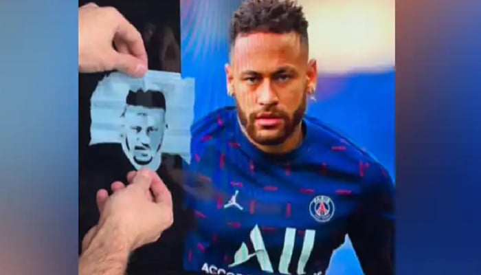 The timelapse video shows the artist cutting out Neymars face.— Screengrab via Instagram