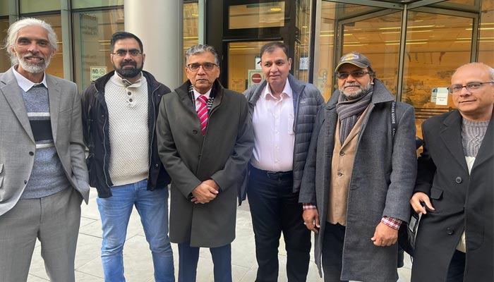 Nadeem Nusrat with his colleagues outside Roll Building of UK High Court, after giving evidence against Altaf Hussain. — Provided by the reporter