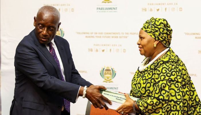 outh Africas former Chief Justice Sandile Ngcobo hands over the report to the Speaker of Parliament, Nosiviwe Mapisa-Nqakula on whether or not President Cyril Ramaphosa should face an impeachment inquiry over the Phala Phala saga in Cape Town, South Africa, November 30, 2022.