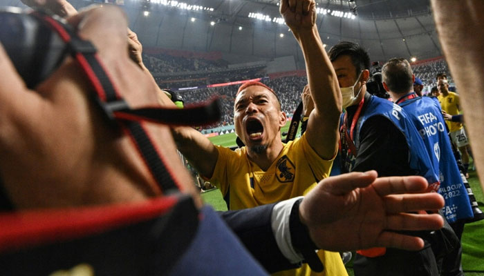 Japan defender Yuto Nagatomo celebrates after his teams win over Spain at the World Cup. AFP