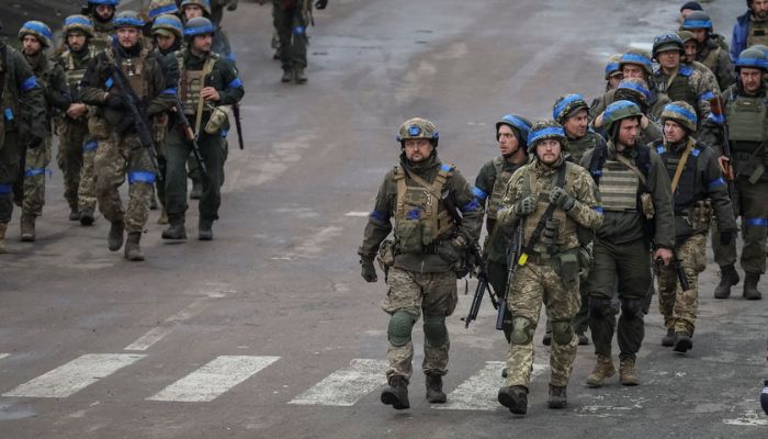 Ukrainian servicemen walk, as Russias attack on Ukraine continues, in the town of Izium, recently liberated by Ukrainian Armed Forces, in Kharkiv region, Ukraine September 14, 2022.— Reuters
