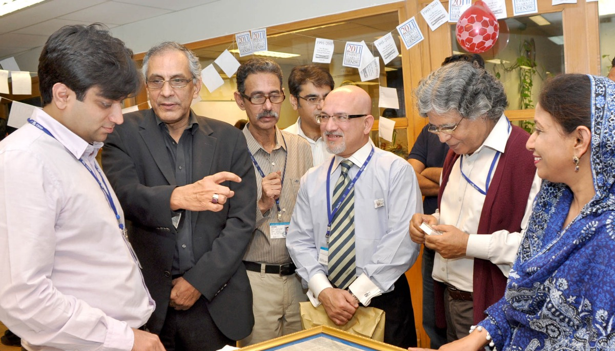 In this file photo, President of Geo and Jang Group Imran Aslam (centre) speaks at an event and can be seen with his younger brother, late editor The News Talat Aslam.