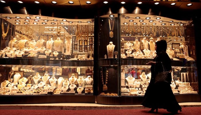 An undated image of a women looking at the jewellery displayed outside a shop. — Reuters/File