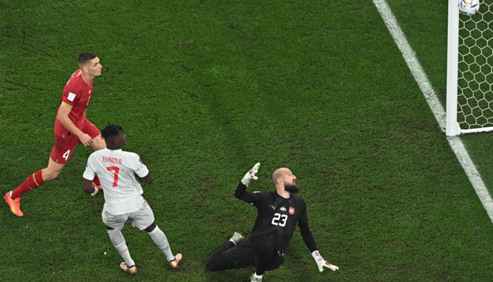 Switzerlands forward Breel Embolo tries to score past Serbia´s goalkeeper Vanja Milinkovic-Savic during the Qatar 2022 World Cup Group G football match between Serbia and Switzerland at Stadium 974 in Doha on December 2, 2022. AFP